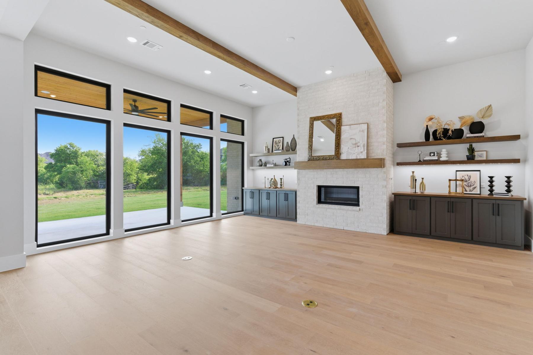 Living room wide view with fireplace and sliding doors